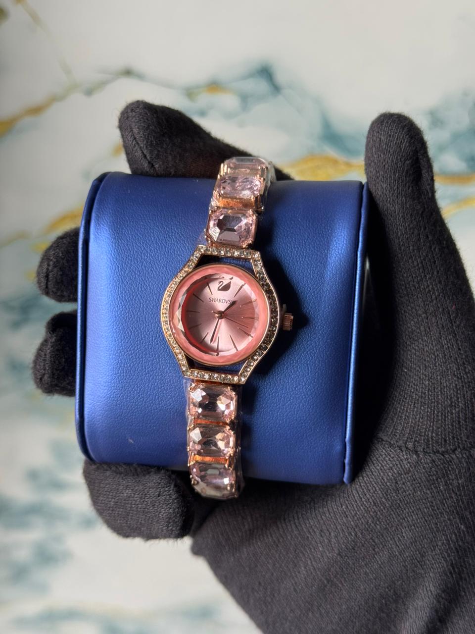 Swarovski Eternal watch featuring a crystal-adorned bracelet and a sunray dial