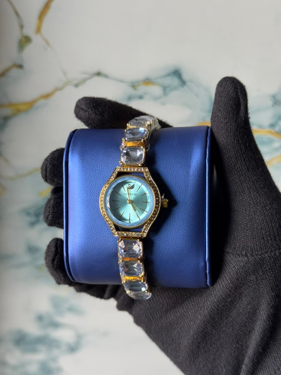 Swarovski Eternal watch featuring a crystal-adorned bracelet and a sunray dial