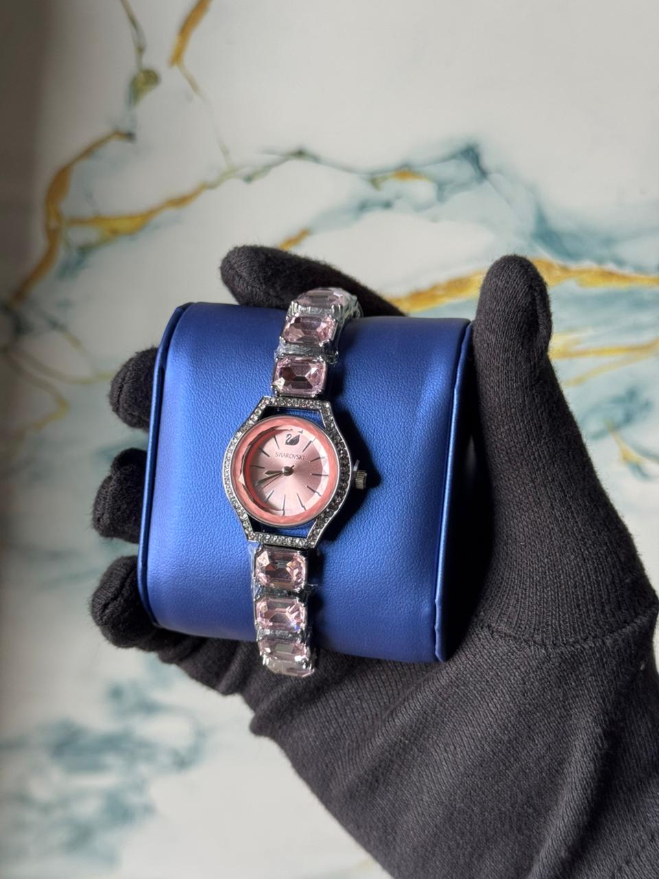 Swarovski Eternal watch featuring a crystal-adorned bracelet and a sunray dial