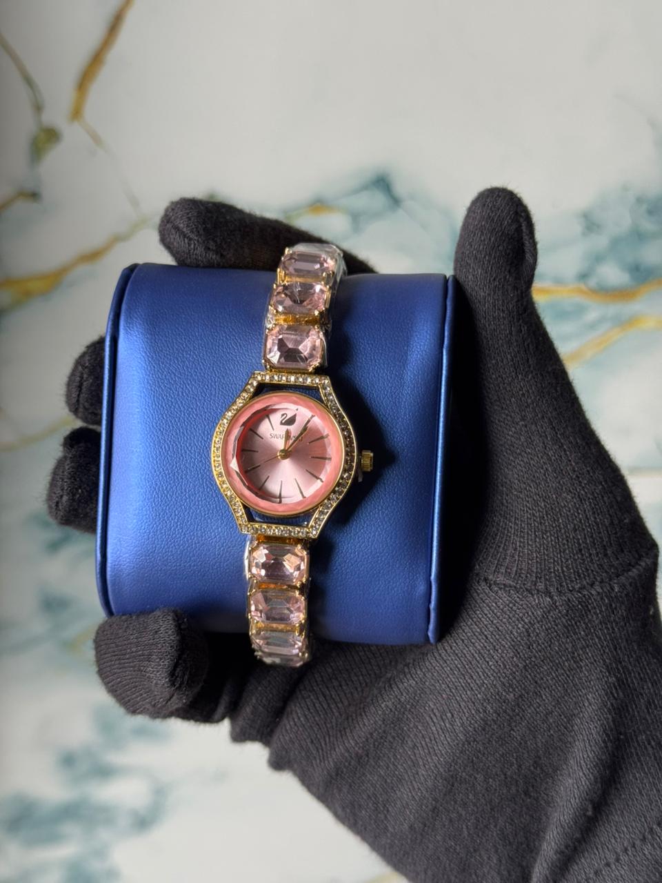 Swarovski Eternal watch featuring a crystal-adorned bracelet and a sunray dial